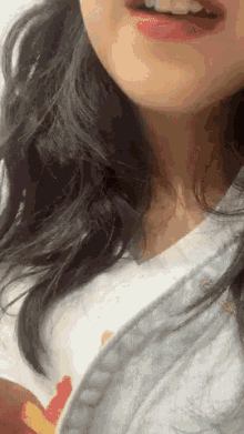 a close up of a woman 's mouth with red lipstick on