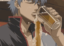 a man drinking a glass of beer with the watermark agw unregistered
