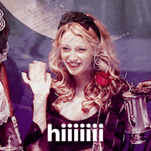 a woman in a purple dress is smiling and holding a cup with the word hiiiiii on it