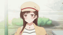 a girl with long brown hair wearing a hat and a jacket
