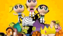 the powerpuff girls are standing next to each other on a yellow background .