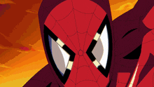 a close up of a spider man 's face with a spider web in the background