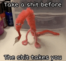 a worm on a string with a caption that says take a shit before the shit takes you