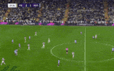 a soccer game is being played with ads for ultra and pasha