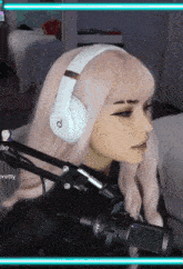 a woman wearing headphones with the letter d on the side