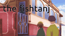 a sign that says the fishtanj with two men standing in front of it