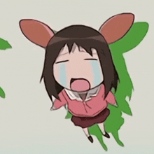 a little girl with bunny ears is crying