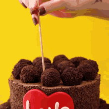 a cake with a red heart on it that says love