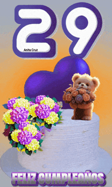 a teddy bear holding a bouquet of flowers on top of a birthday cake