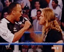 a fox 8 broadcast of a wrestling match between the rock and a woman