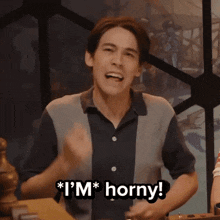 a man with his mouth open and the words " i 'm horny " above him