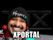a man wearing a beanie that says blazord x