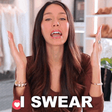 a woman says i swear with her hands up in the air