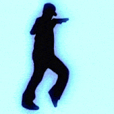 a silhouette of a man in a baseball cap is walking