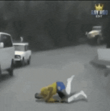 a man is laying on the ground in front of a truck with ray rod edit written on the bottom