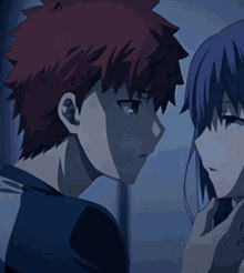 a man with red hair is kissing a woman with blue hair