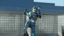 a man in a superhero costume is standing in front of a glass building