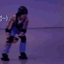 a person wearing a helmet and knee pads stands in front of a sign that says ' ( ) ' on it
