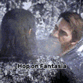a man and woman are hugging in the snow and the words hop on fantasia are on the bottom