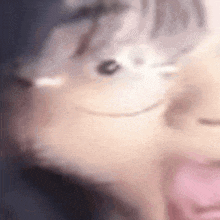 a close up of a person 's face with a smiley face on it .