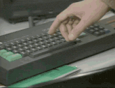 a close up of a person typing on a keyboard that says cf on the top