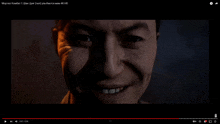 a close up of a man 's face is displayed on youtube