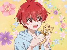 a boy with red hair is feeding a cat a bottle of milk