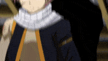 a blurry picture of a person with a scarf around their neck and a black jacket