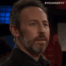 a close up of a man 's face with the hashtag youngertv at the bottom