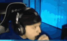 a person wearing headphones with the word s-rap on them