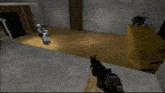 a person is holding a gun in a video game while another person is laying on the ground