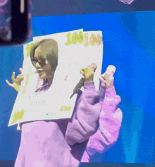 a person holding up a sign that says 10908