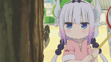 a girl with horns is standing next to a tree holding a stick and looking at a cicada .