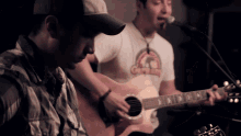 a man in a gorilla shirt sings into a microphone