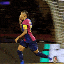 a soccer player wearing a number 19 jersey is running towards the goal