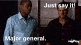 two men standing next to each other with a caption that says just say it