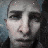 a close up of a man 's face with confetti coming out of it