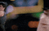 a blurry picture of a woman in a black dress dancing