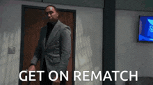 a man in a suit stands in front of a door with the words get on rematch written on it