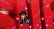 a woman in a black hat is in front of the word sure