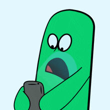 a green cartoon character with a surprised look on his face is holding a cell phone