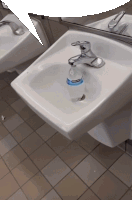 a bottle of kleenex sits in a sink