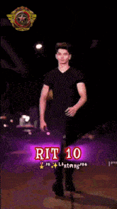 a man in a black shirt is walking down a street with rit 10 in red letters