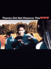 a blurry image of a group of people with the words thanos did not deserve this