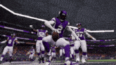 a football player in a purple uniform with the number 2 on his jersey