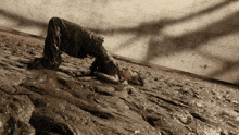 a person is laying on their back in a puddle of mud