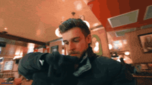 a blurry picture of a man in a black jacket with the words ' brooklyn ' on the bottom right corner