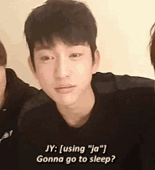 a close up of a man 's face with the words `` jy : using `` ja '' gonna go to sleep ''