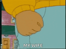 a cartoon of a man 's fist with the words " my wife " on the bottom