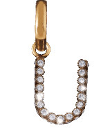 a gold letter u pendant with diamonds on it